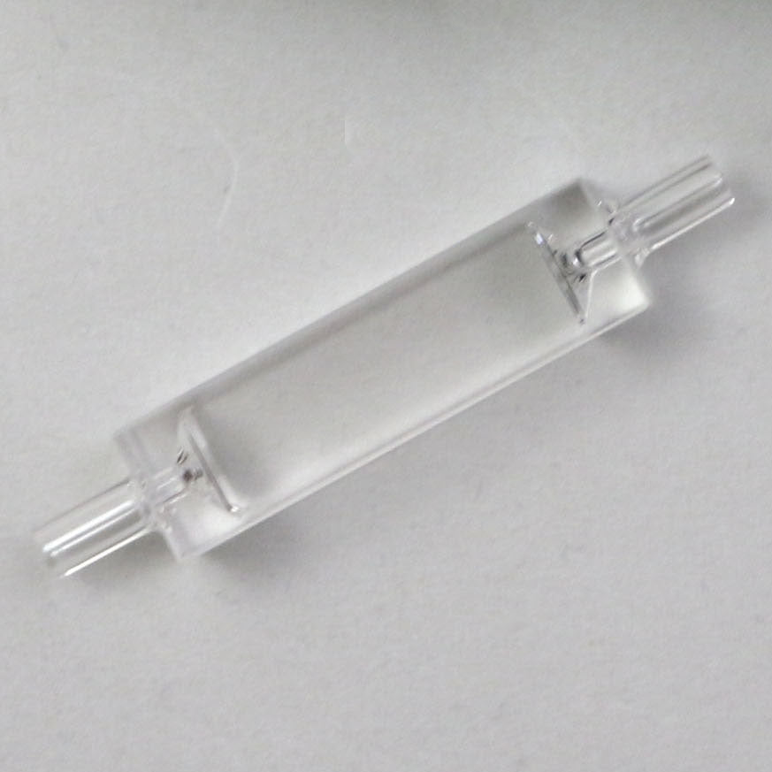 Clear glass component on a gray background