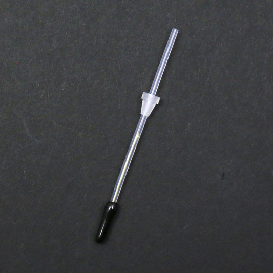 Thin metal rod with a black tip on a gray background