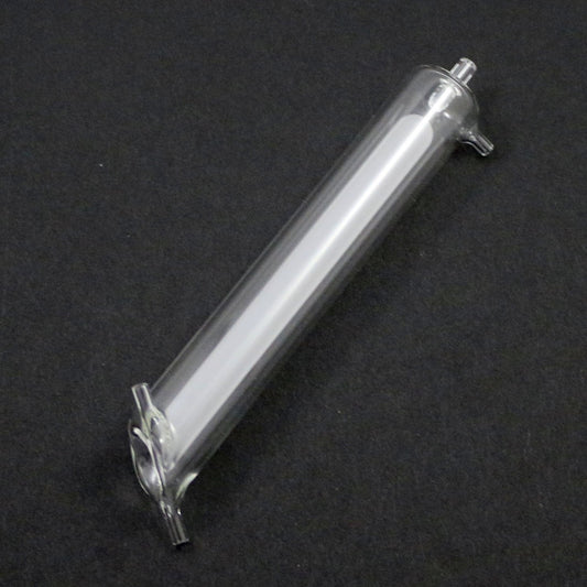Clear cylindrical object on a black background