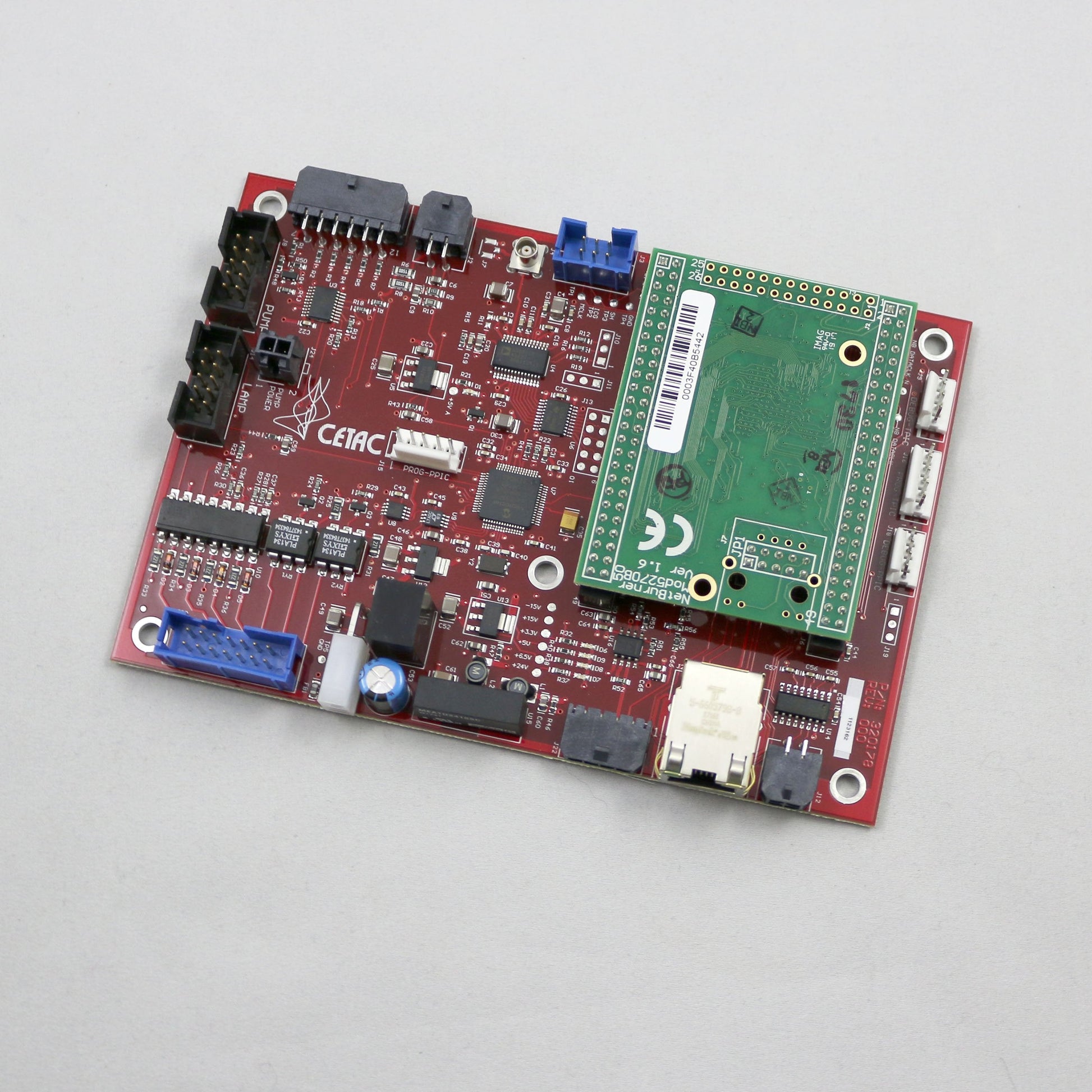 Electronic circuit board with various components on a gray background