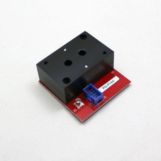 Electronic component with red and black casing on a white background