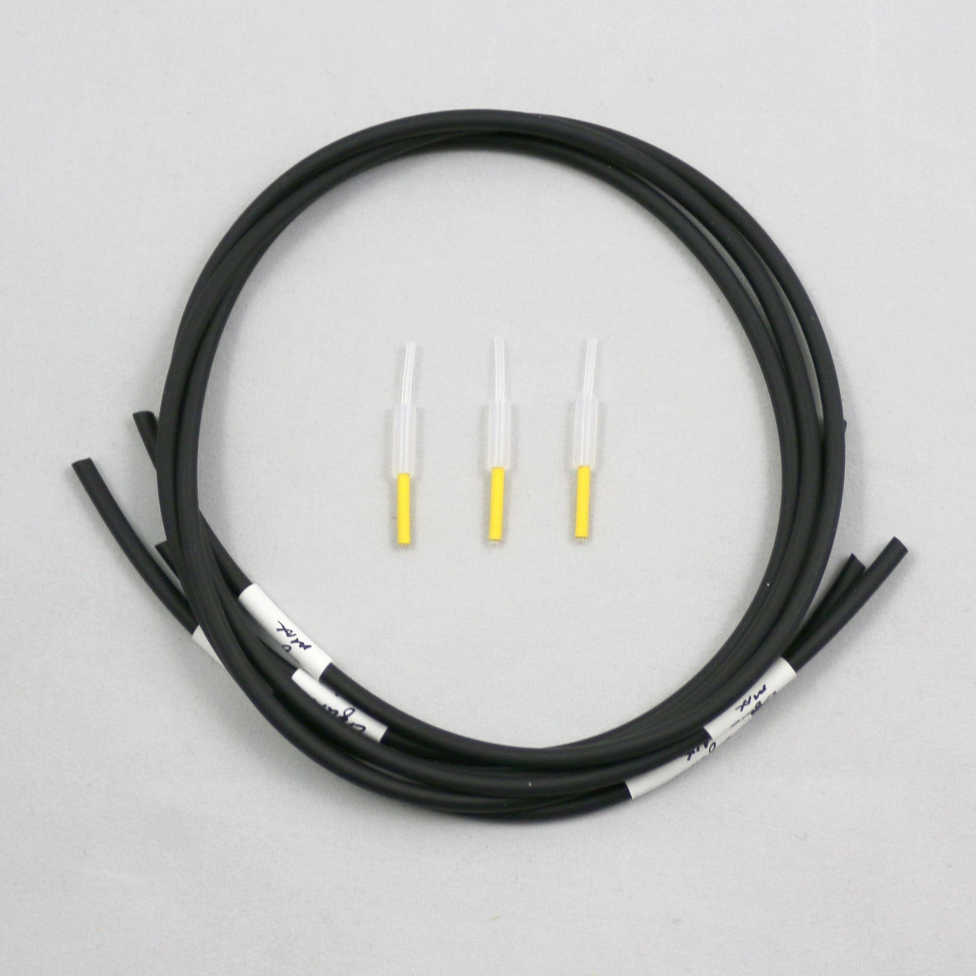 Coiled black tubing pieces with connectors