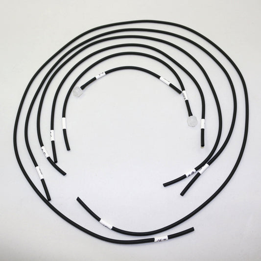 Set of black hoses with white labels arranged in a circular pattern on a light gray background