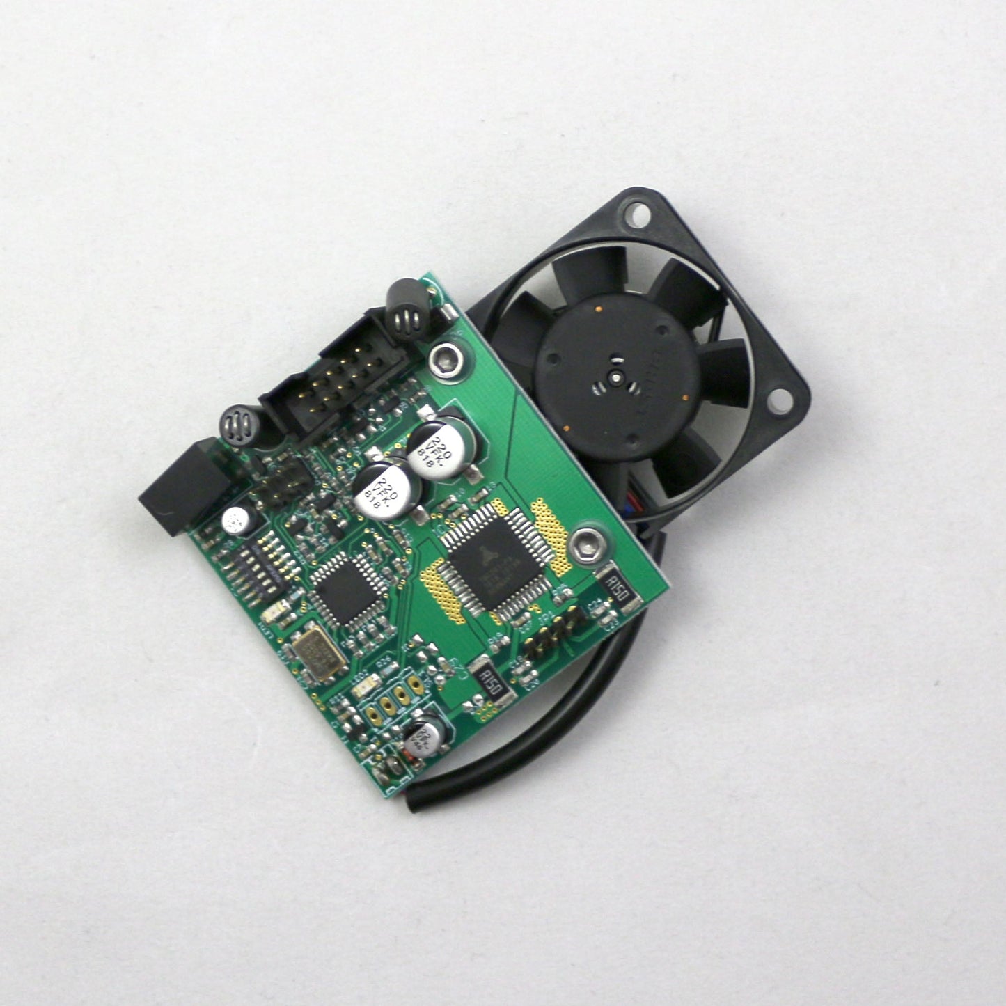 Electronic circuit board with a fan on a white background