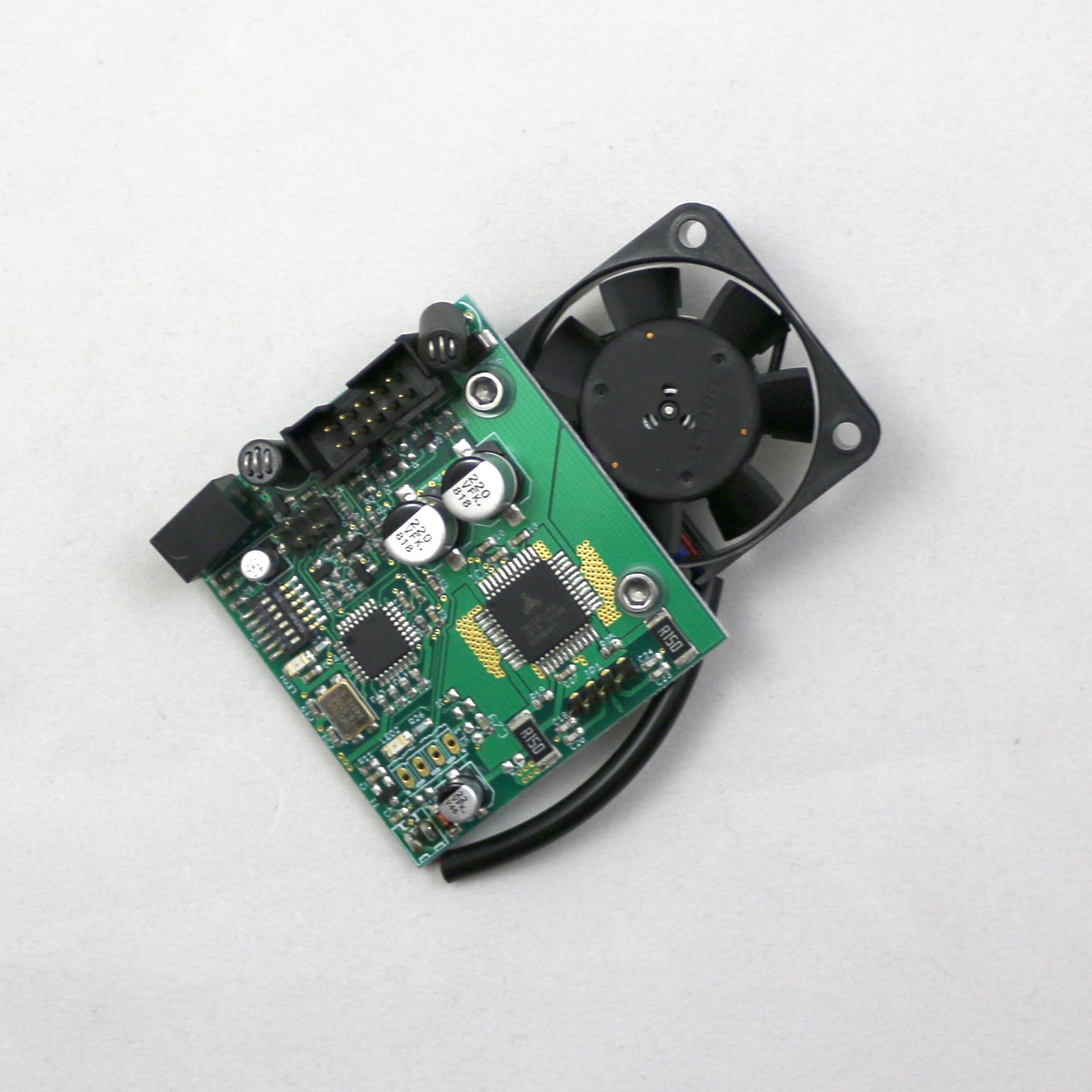 Electronic circuit board with a fan on a white background