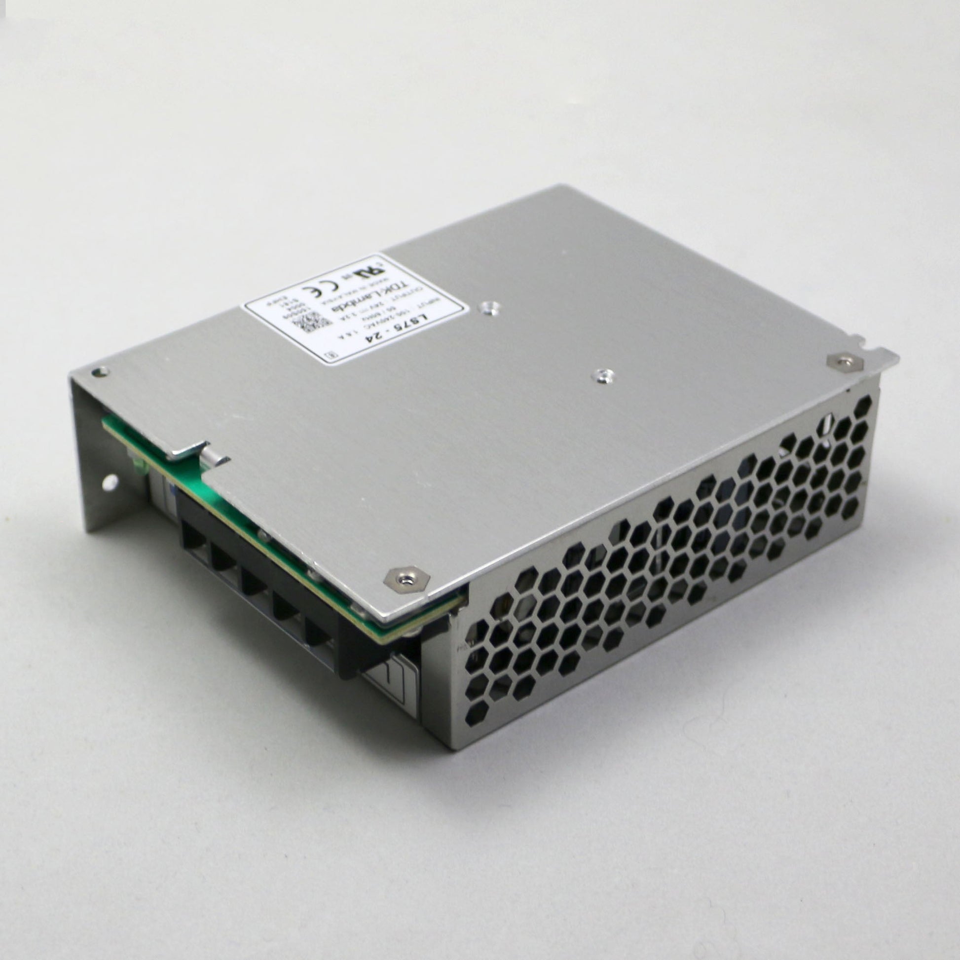 Metal electronic component with a label on a white background