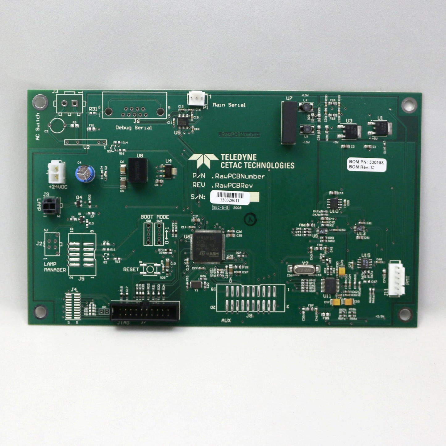 Green circuit board with Teledyne CETAC Technologies logo on a white background
