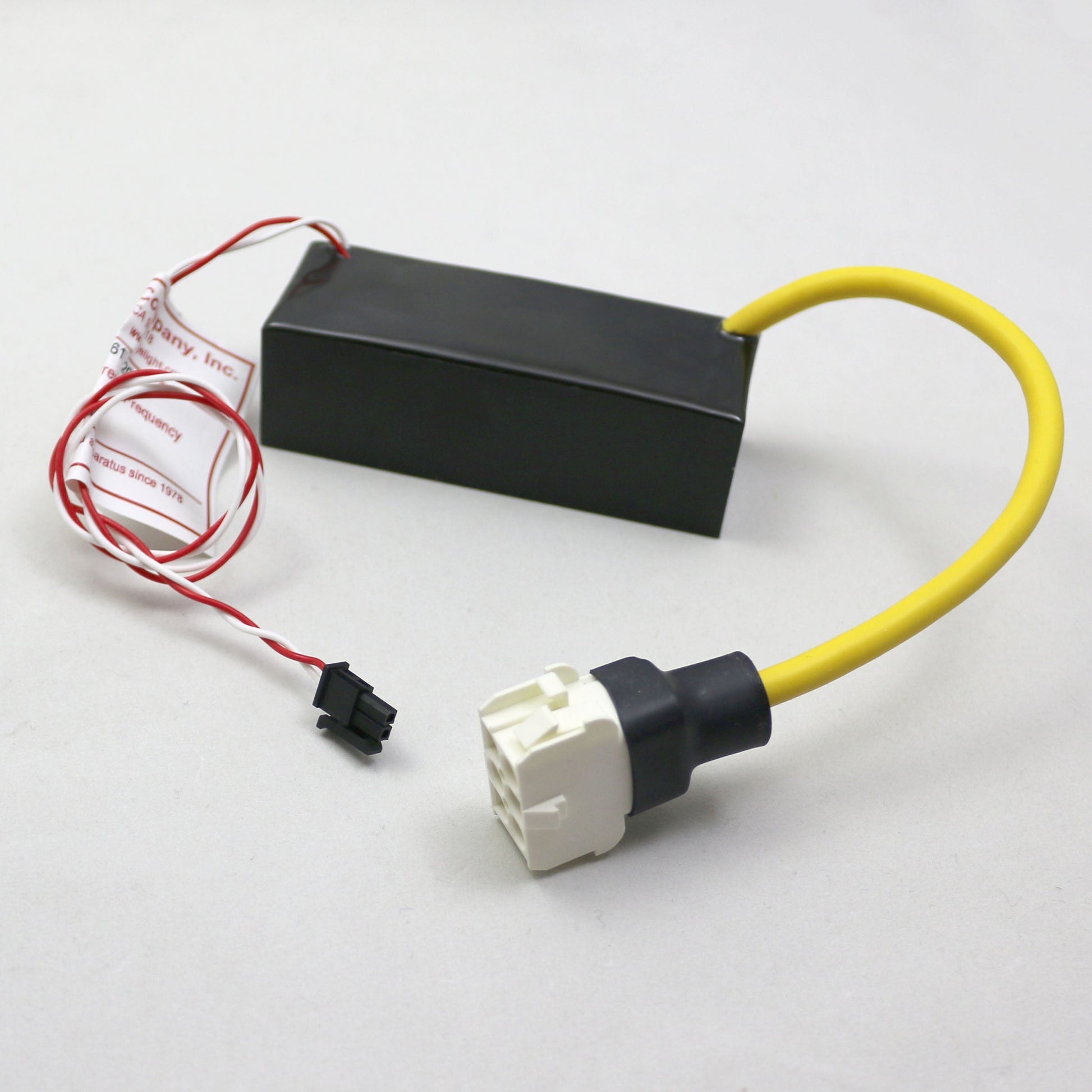 Electrical connector with black box, red and yellow wires on a white background