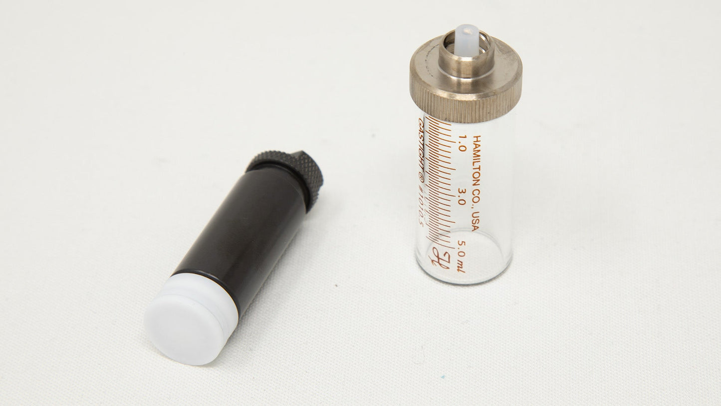 Two piece syringe with measurement markings.