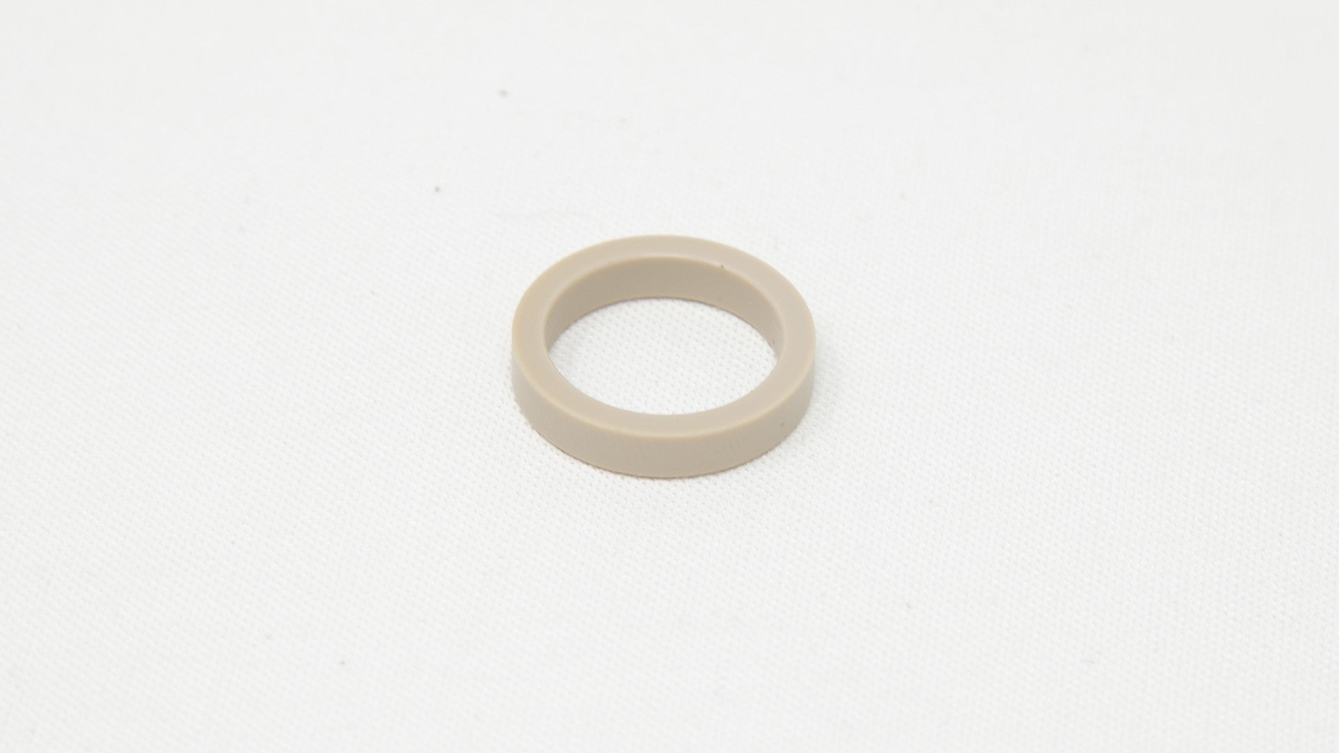 Circular plastic seal.