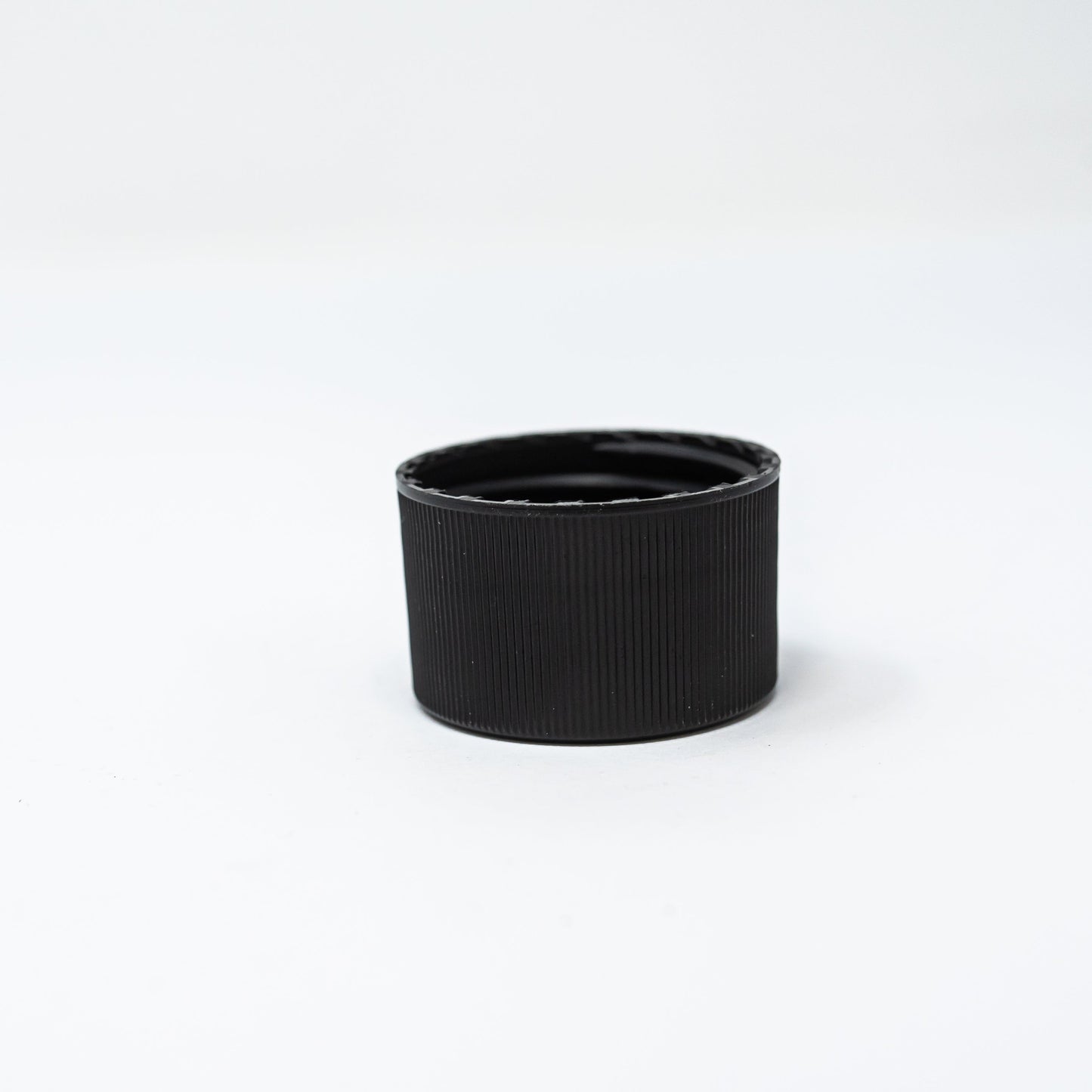 Black plastic bottle cap