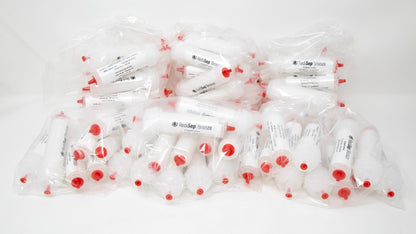 Several white tubes with black labels