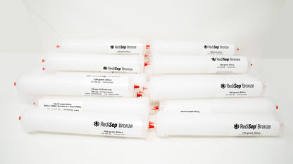 Several white tubes with black labels