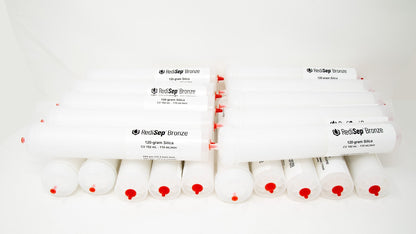 Several white tubes with black labels