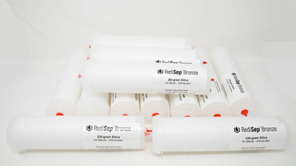 Several white tubes with black labels