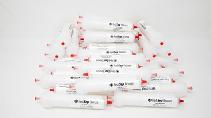 Several white tubes with black labels