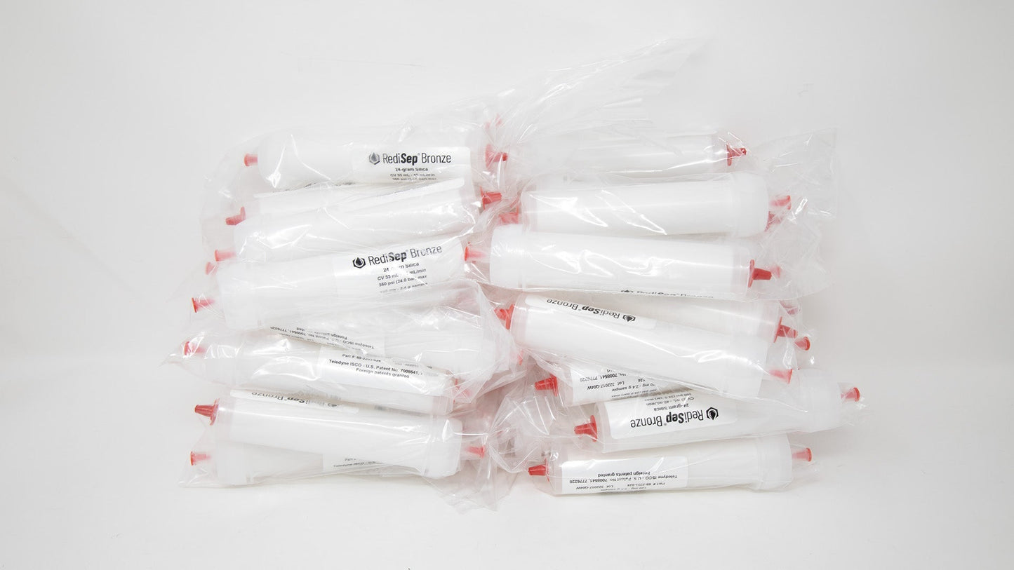 Several white tubes with black labels