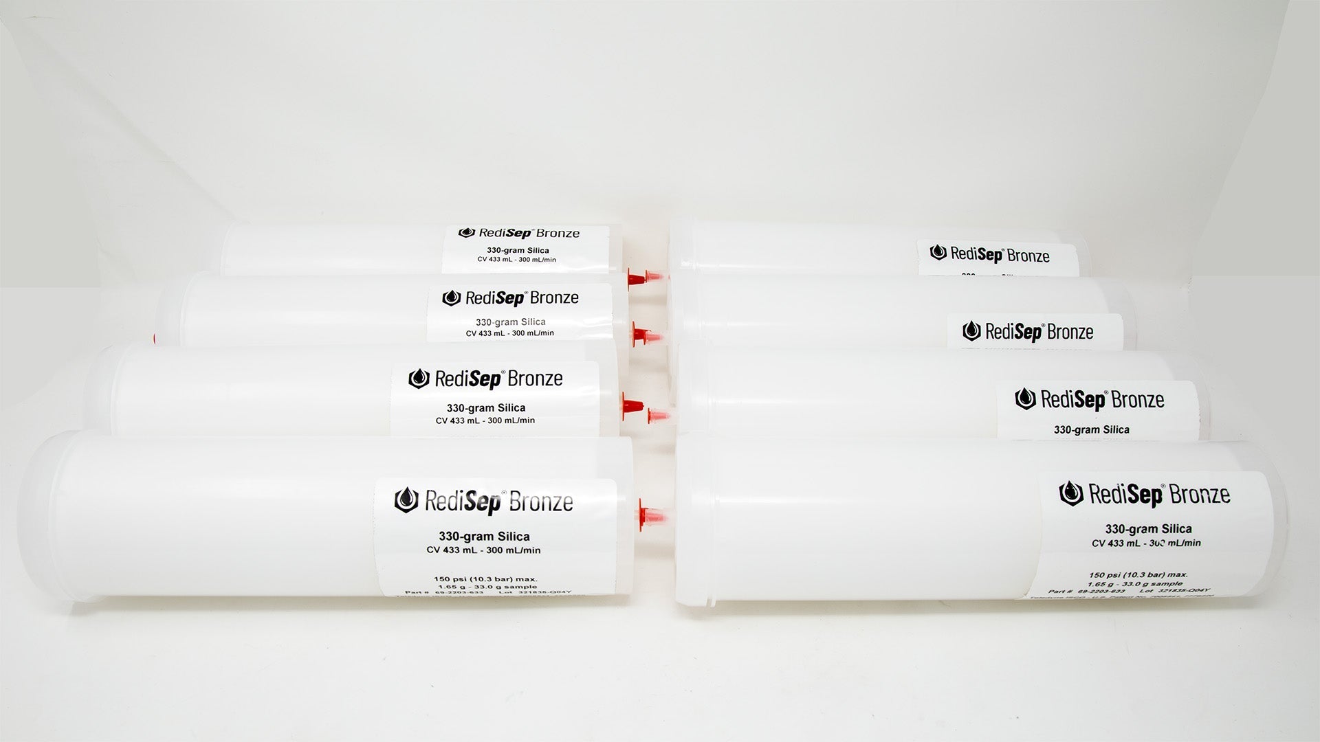 Several white tubes with black labels