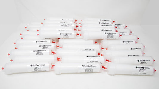 Several white tubes with black labels